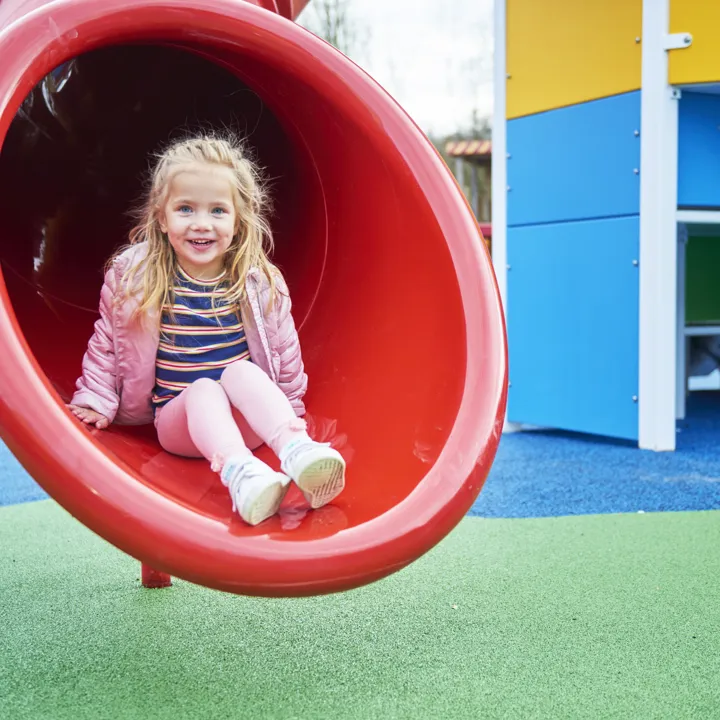 Girl on slide in DUPLO Playtown