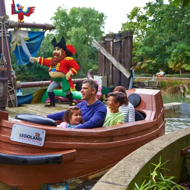 Family with LEGO models on Pirate Falls log flume at the LEGOLAND® Windsor Resort