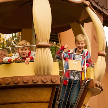 Children riding Aero Nomad ferris wheel in Kingdom of the Pharaohs