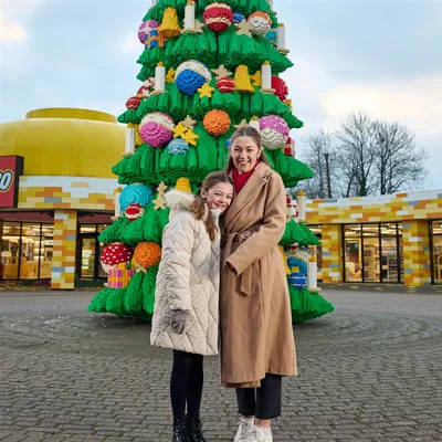 Family In Front Of DUPLO Christmas Tree