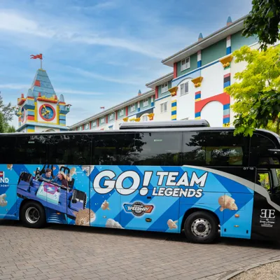 LEGOLAND Windsor Resort Evan Evans Branded Coach Blue Side In Front Of LEGOLAND Hotel