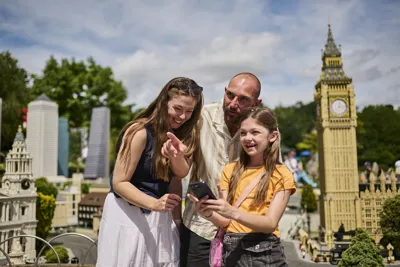 Family using LEGOLAND Windsor app in Miniland