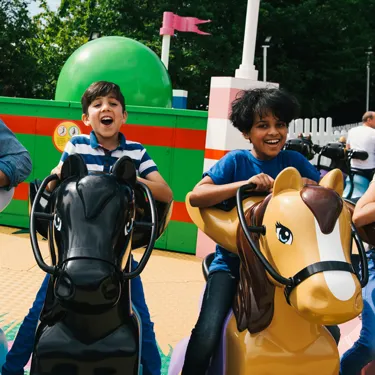 Families laughing and smiling on Mia's Riding Adventure