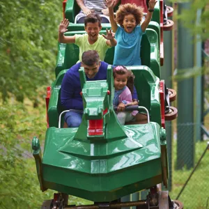 Family smiling on The Dragon at the LEGOLAND® Windsor Resort