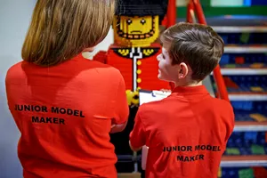 Children checking LEGO models in Junior Model Maker Experience