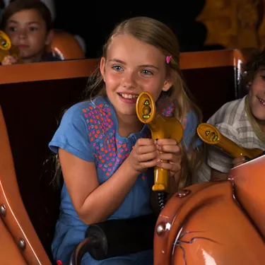 Children holding laser blasters in Laser Raiders at the LEGOLAND Windsor Resort