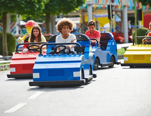 Children driving cars at LEGO® City Driving School at LEGOLAND® Windsor Resort
