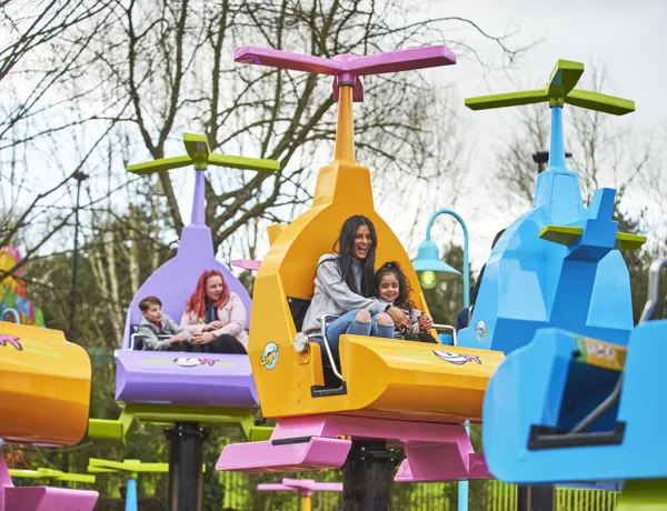 Mother and girl laughing on DUPLO Valley Airport
