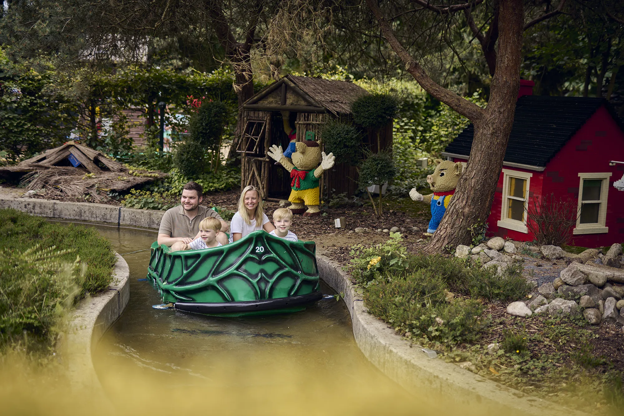 Family looking at the LEGO models of fairy tale stories on Fairy Tale Brook