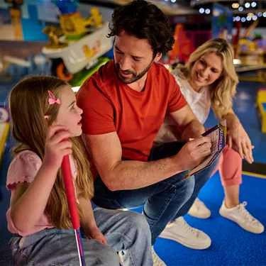 Father taking score with daughter at LEGOLAND Adventure Golf
