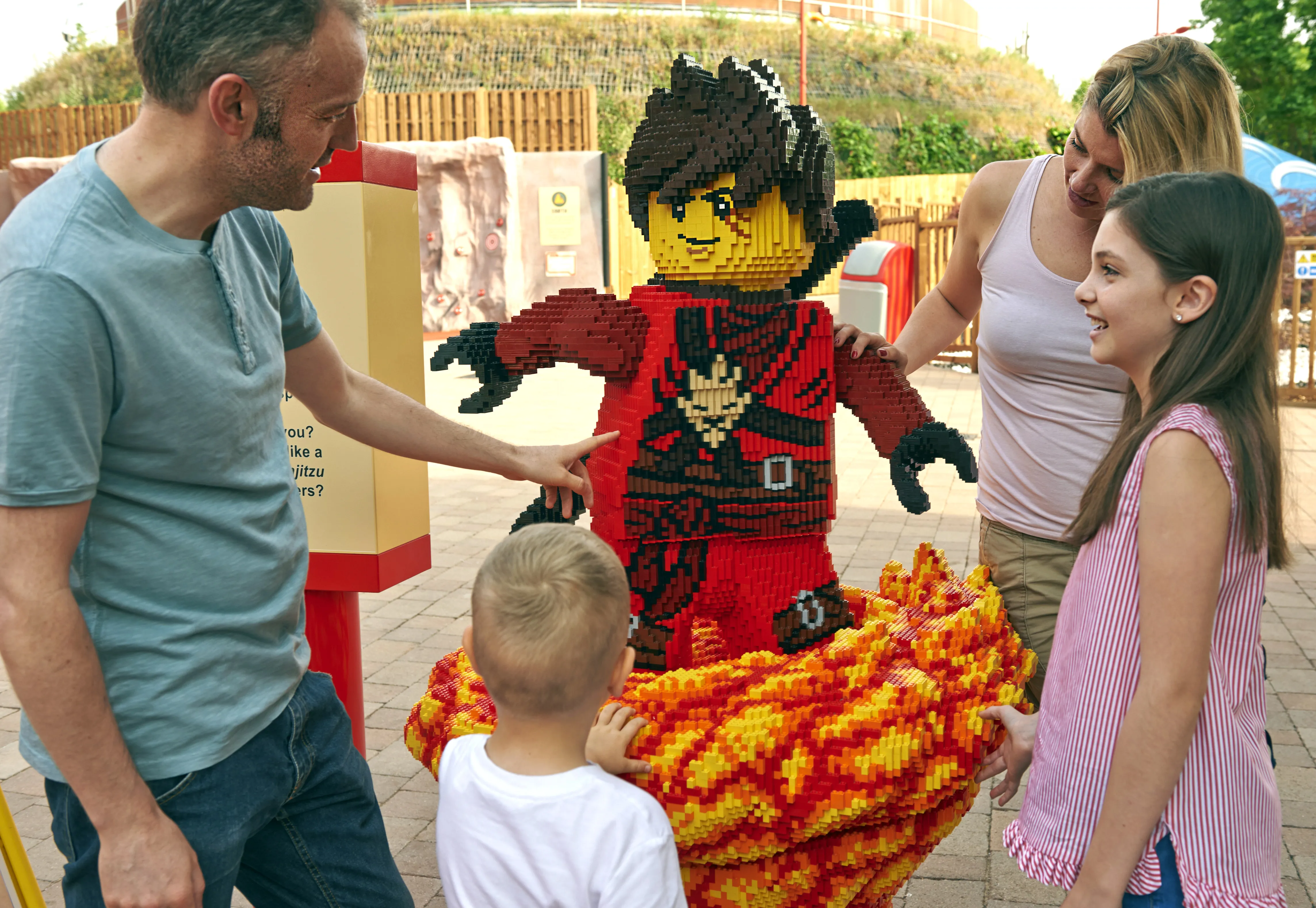 Family with LEGO model of Kai from LEGO NINJAGO