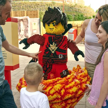 Family with LEGO model of Kai from LEGO NINJAGO