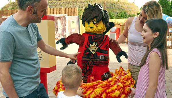 Family with LEGO model of Kai from LEGO NINJAGO