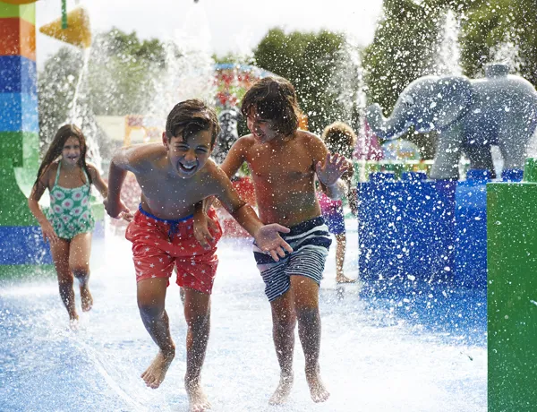 Children exploring and laughing in DUPLO® Splash Safari at the LEGOLAND® Windsor Resort