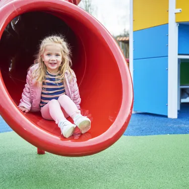 Girl on slide in DUPLO Playtown