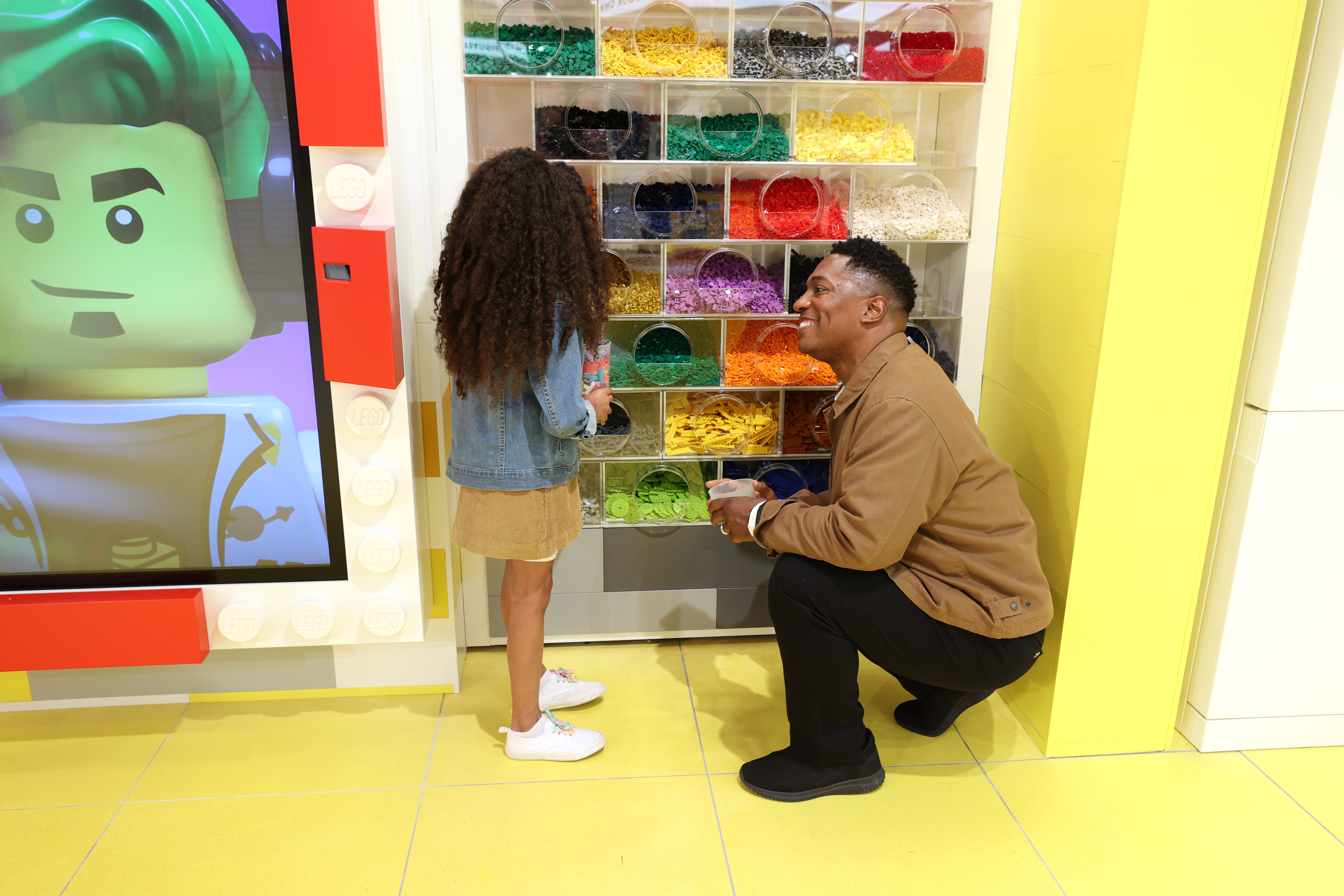 Father and child at Personalisation Studio at The LEGO Store