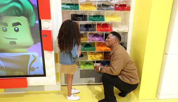 Father and child at Personalisation Studio at The LEGO Store