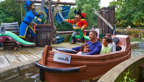 Family with LEGO models on Pirate Falls log flume at the LEGOLAND® Windsor Resort