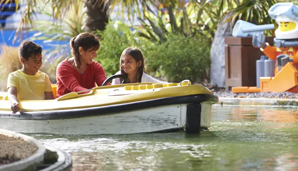 Family on boat with LEGO diver minifigures at Coastguard HQ at the LEGOLAND Windsor Resort