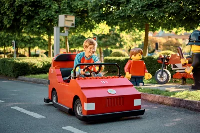 Boy Driving LEGO City Driving School Car
