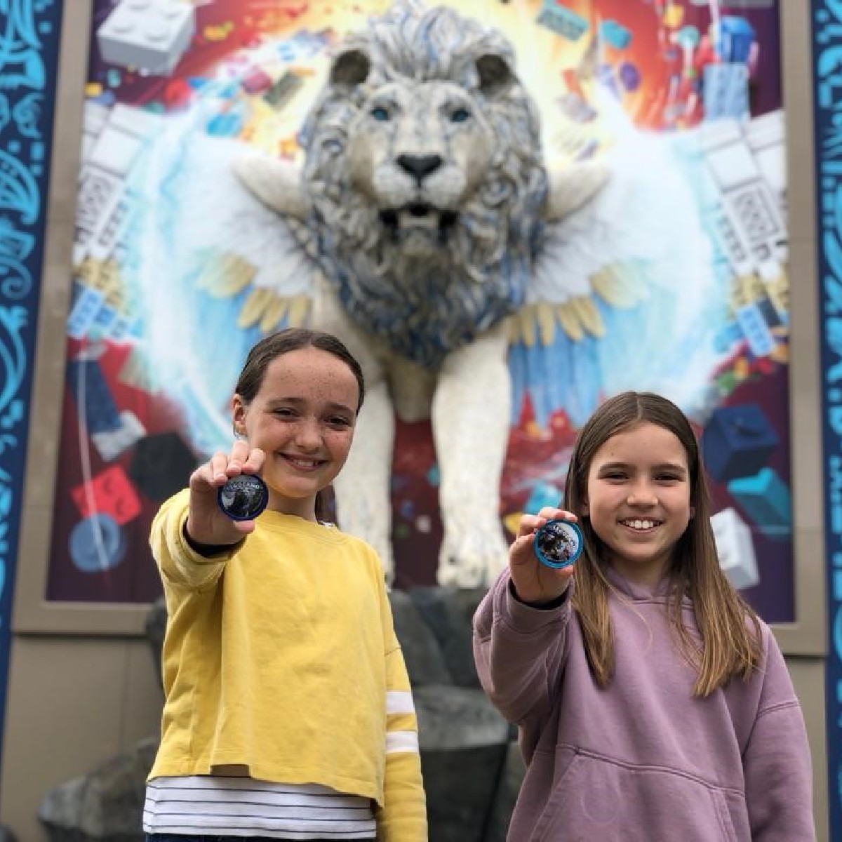 Girls with LEGO MYTHICA POP Badges outside of Flight of the Sky Lion