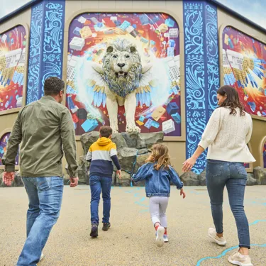 Family walking towards Maximus at Flight of the Sky Lion in LEGO MYTHICA