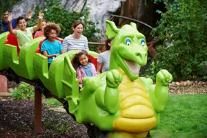 Families smiling on Dragon's Apprentice at the LEGOLAND Windsor Resort