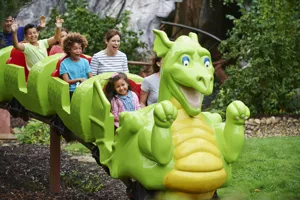 Families smiling on Dragon's Apprentice at the LEGOLAND Windsor Resort