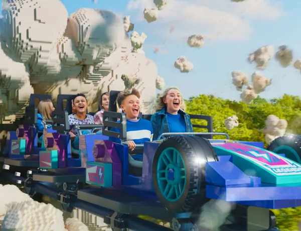 Families enjoying the Minifigure Speedway Rollercoaster with "popcorn power"
