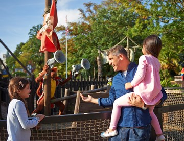 Family looking at LEGO models in Pirate Shores at the LEGOLAND Windsor Resort