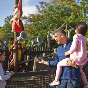 Family looking at LEGO models in Pirate Shores at the LEGOLAND Windsor Resort