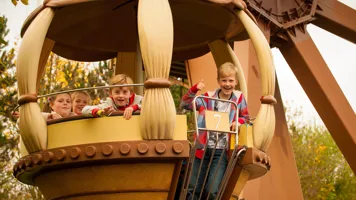 Children riding Aero Nomad ferris wheel in Kingdom of the Pharaohs