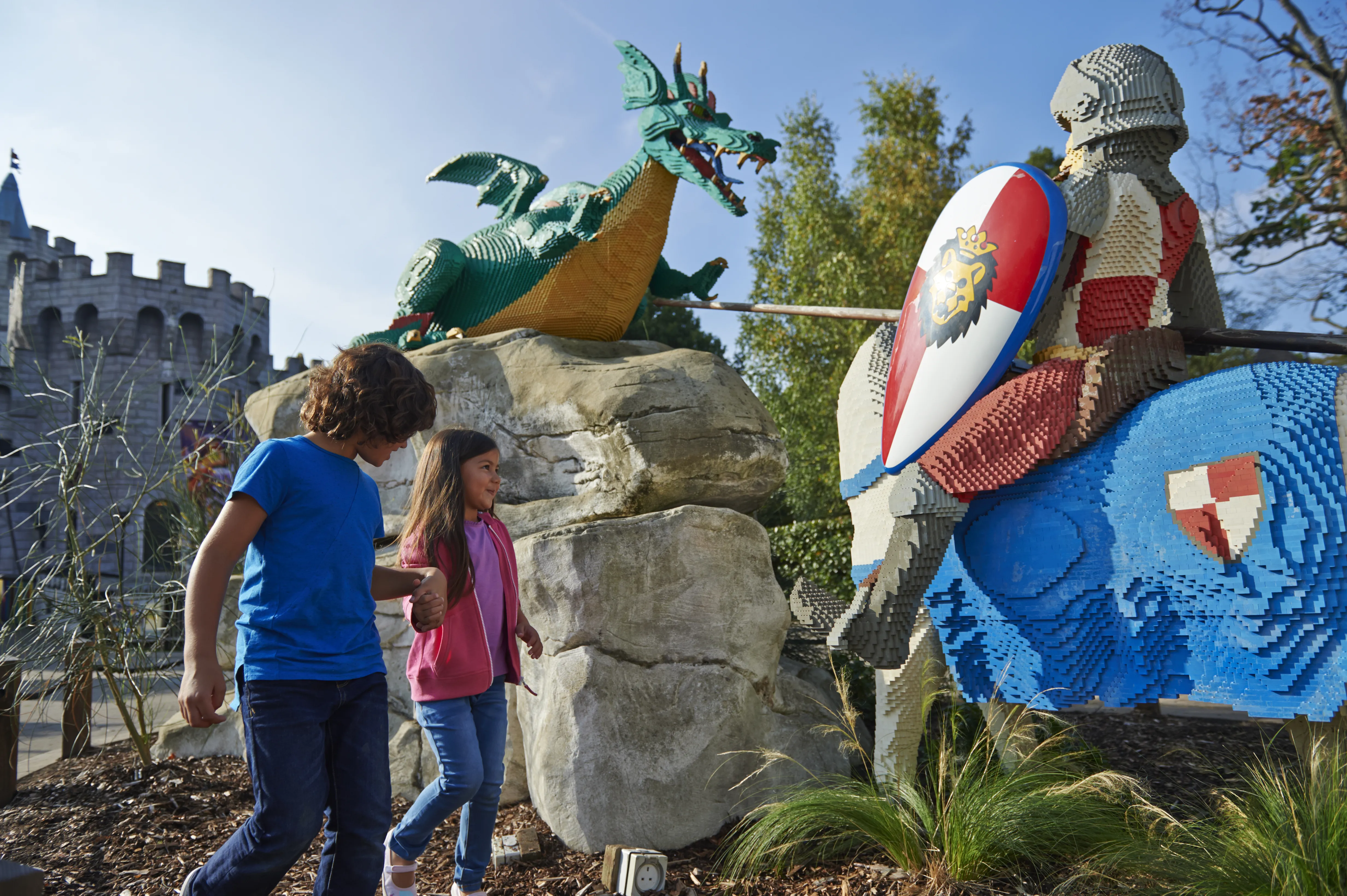 Boy and girl with LEGO model of Knight and Dragon