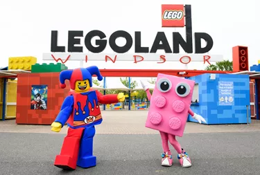 Jester and Pink Brick outside the entrance of LEGOLAND Windsor Resort