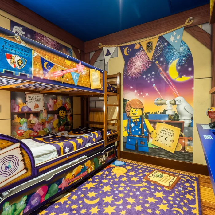 Kids area with bunk beds and trundle bed of a Wizard room in the LEGOLAND Castle Hotel