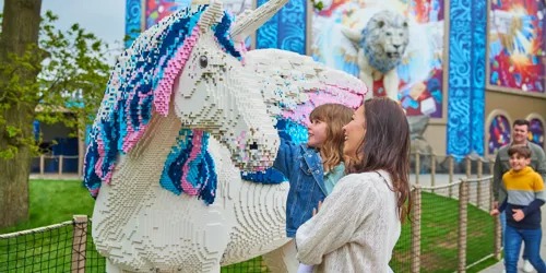 Mother and daughter looking at LEGO model of an Alicorn