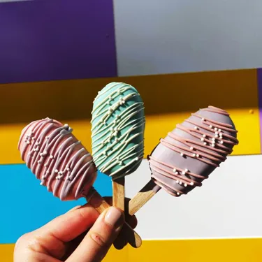 Multi-coloured decorated Cake Pops available at Heartlake Cafe