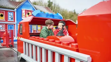 Boys laughing and looking at each other on Fire Academy at the LEGOLAND® Windsor Resort