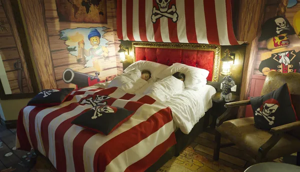 Children Sleeping in parent's bed in Premium Pirate Room at the LEGOLAND Resort Hotel
