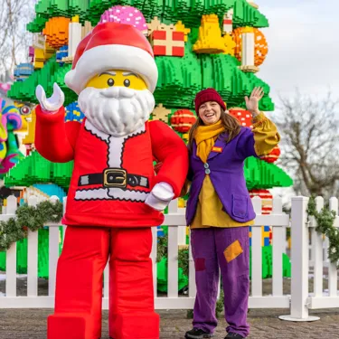 LEGO Santa And Elf Next To LEGO DUPLO Christmas Tree