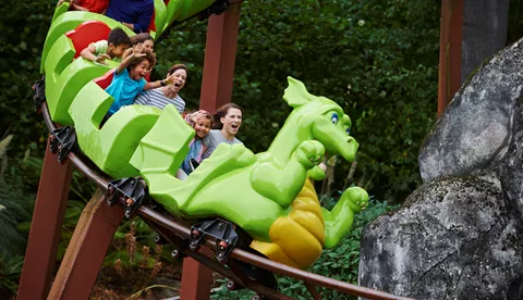 Families smiling on Dragon's Apprentice at the LEGOLAND Windsor Resort