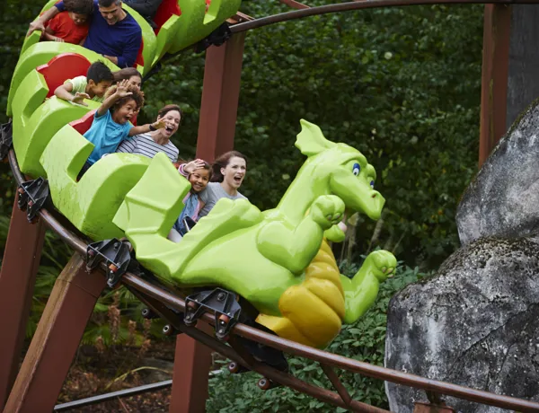 Families smiling on Dragon's Apprentice at the LEGOLAND Windsor Resort