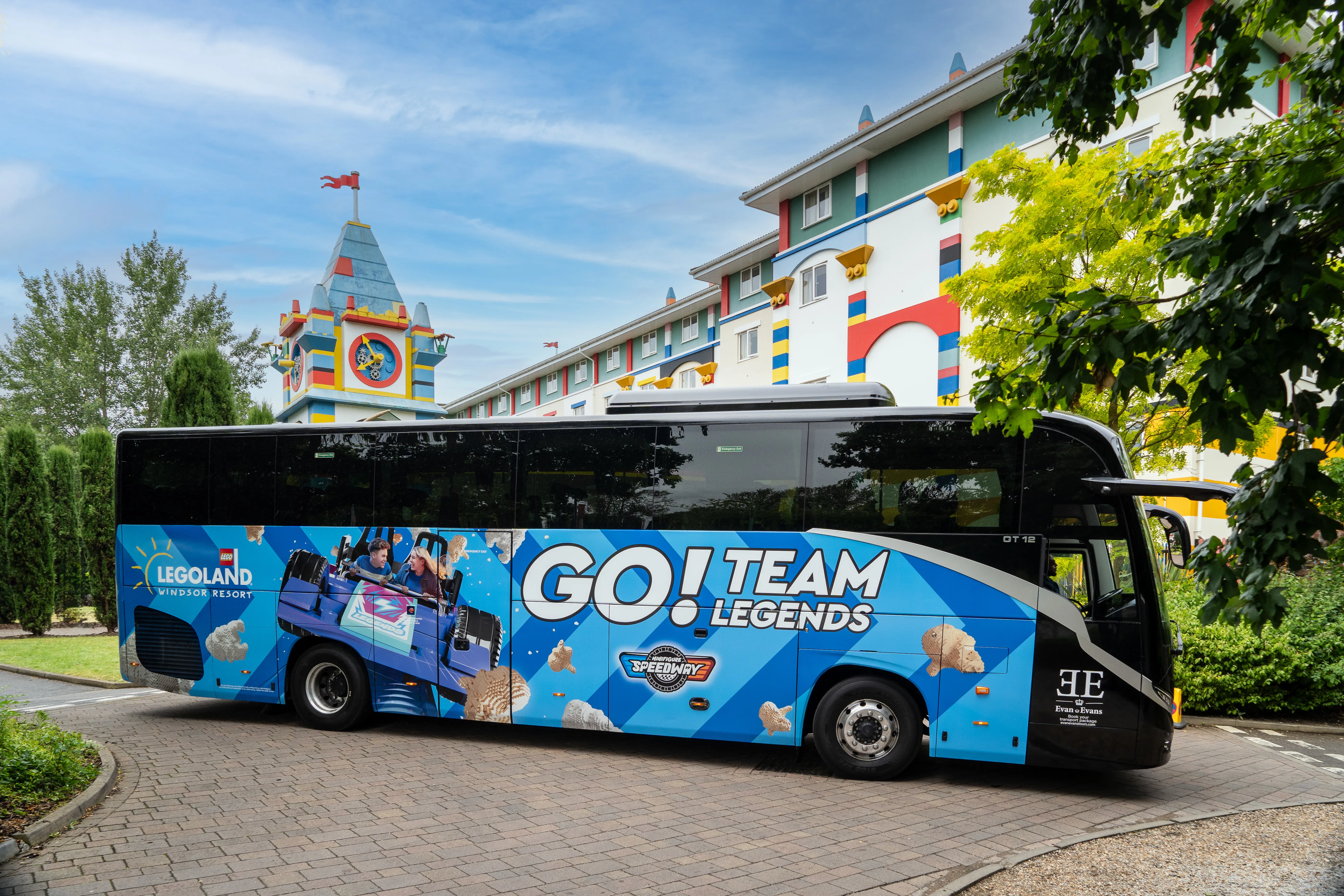 LEGOLAND Windsor Resort Evan Evans Branded Coach Blue Side In Front Of LEGOLAND Hotel