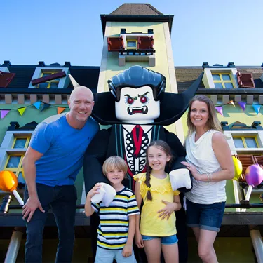 Family with Lord Vampyre outside Haunted House Monster Party at the LEGOLAND Windsor Resort