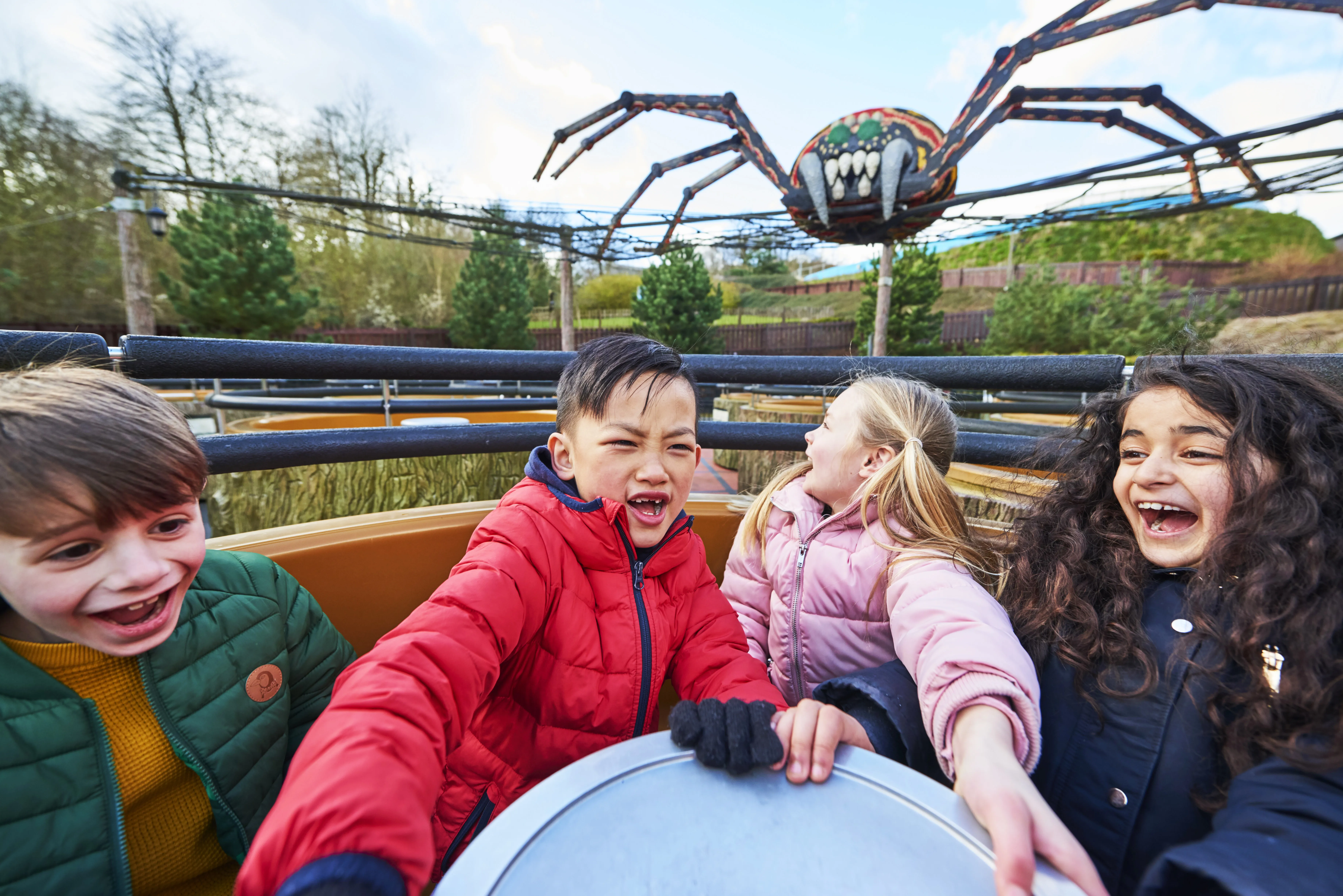 Children laughing and smiling on Spinning Spider at the LEGOLAND Windsor Resort