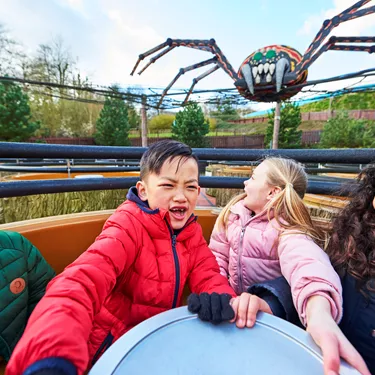 Children laughing and smiling on Spinning Spider at the LEGOLAND Windsor Resort