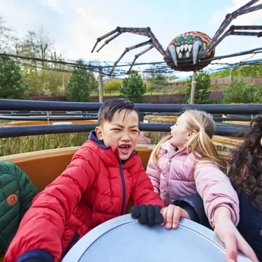 Children laughing and smiling on Spinning Spider at the LEGOLAND Windsor Resort