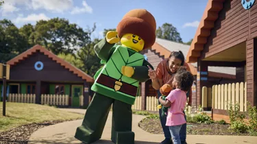 Mother and daughter meeting Forest Elf in the LEGOLAND Woodland Village