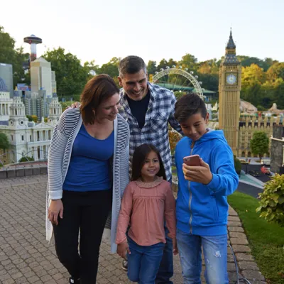 Family using LEGOLAND app in Miniland at the LEGOLAND Windsor Resort