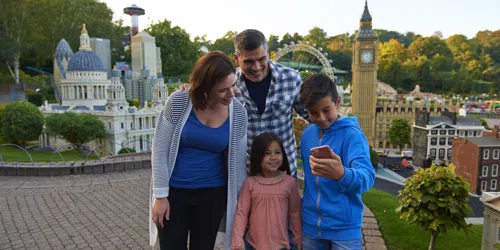 Family using LEGOLAND app in Miniland at the LEGOLAND Windsor Resort